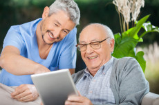 Elderly man and caregiver