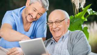 Elderly man and caregiver